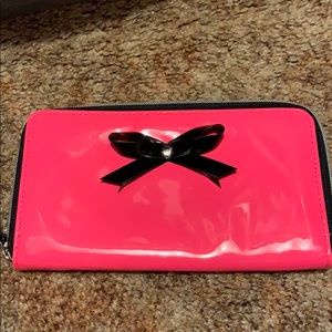 neon pink wallet with bow